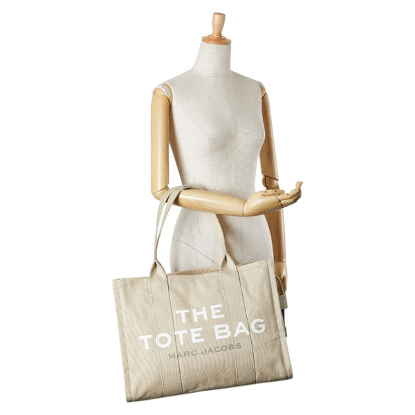 マークジェイコブス ザ ミディアム トラベラー グラフィック トートバッグ ベージュ ホワイト キャンバス レディース MARC JACOBS 【中古】