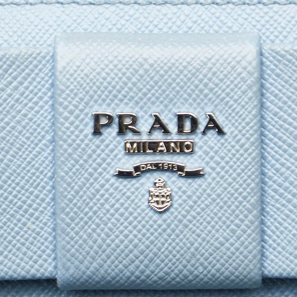 プラダ フィオッコ リボンモチーフ L字ファスナー 長財布 1ML183 ライトブルー サフィアーノレザー レディース PRADA 【中古】